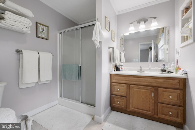 full bathroom with tile patterned floors, a stall shower, ornamental molding, baseboards, and vanity
