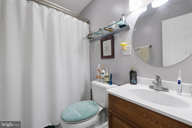 bathroom with toilet and vanity