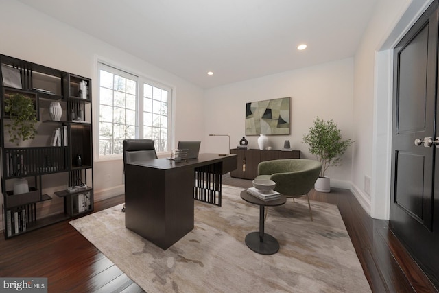 office with dark wood-style floors, recessed lighting, and baseboards