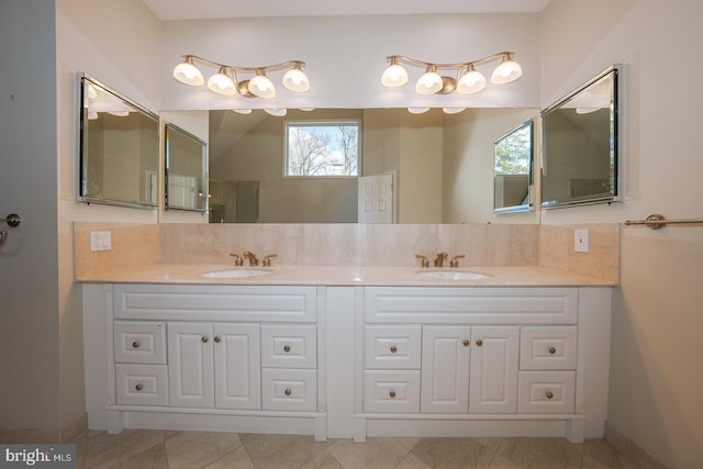 bathroom featuring double vanity and a sink