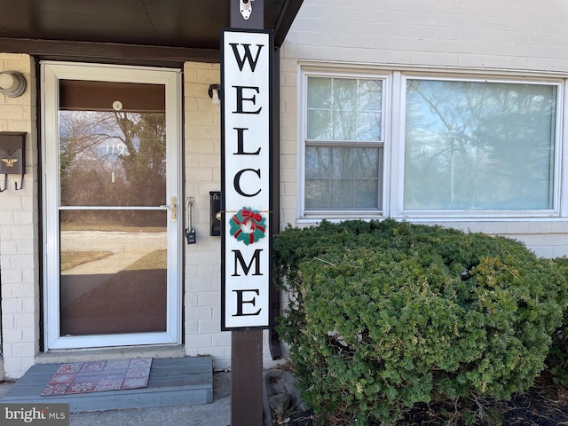 property entrance with concrete block siding