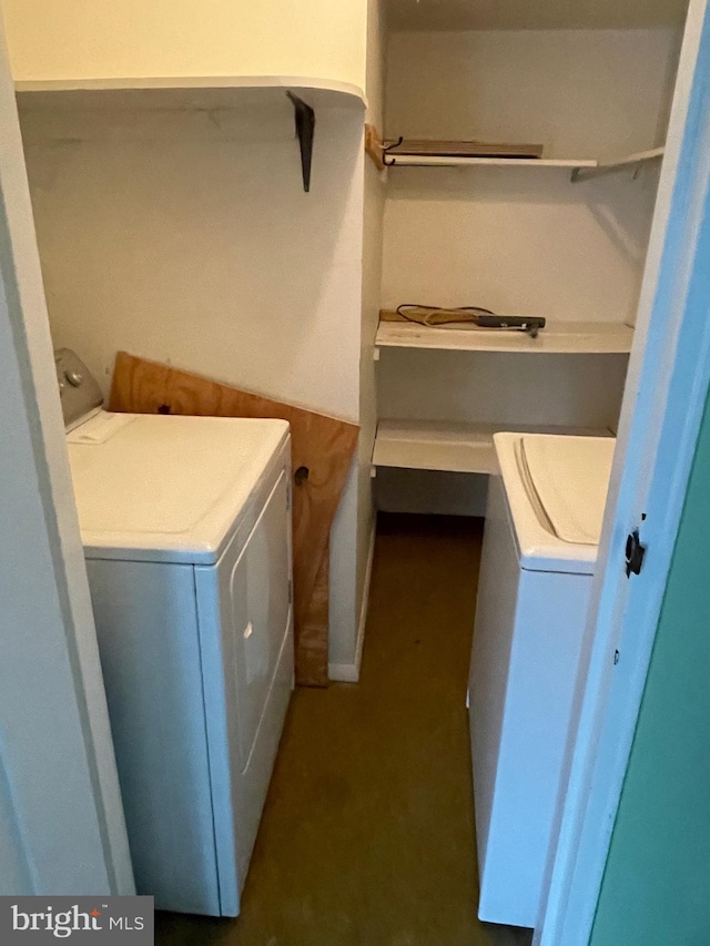 clothes washing area with laundry area and washer and clothes dryer