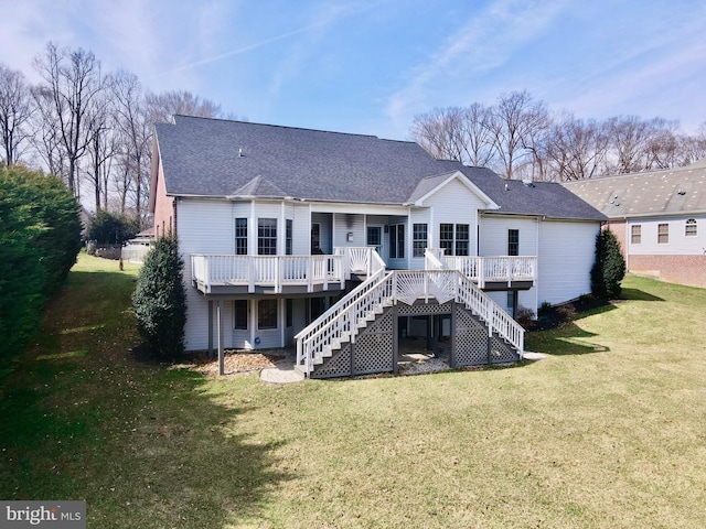 back of house with a lawn, a wooden deck, stairs, and a shingled roof