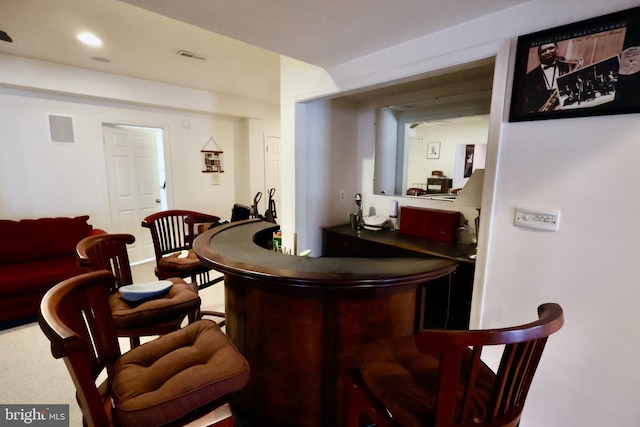 bar with recessed lighting, indoor wet bar, and visible vents