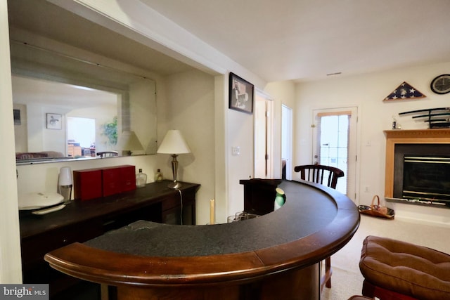 living room with a glass covered fireplace