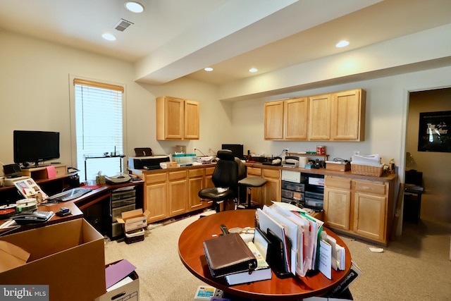 office space with light carpet, visible vents, recessed lighting, and built in study area