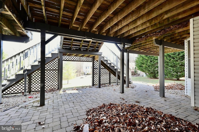 view of patio / terrace featuring stairs