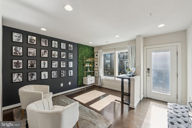 sitting room with recessed lighting, baseboards, and wood finished floors