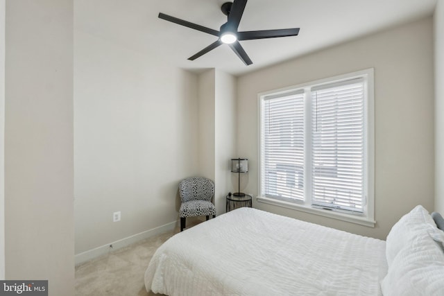 bedroom with carpet flooring, baseboards, and ceiling fan