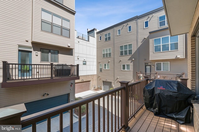 wooden deck featuring grilling area