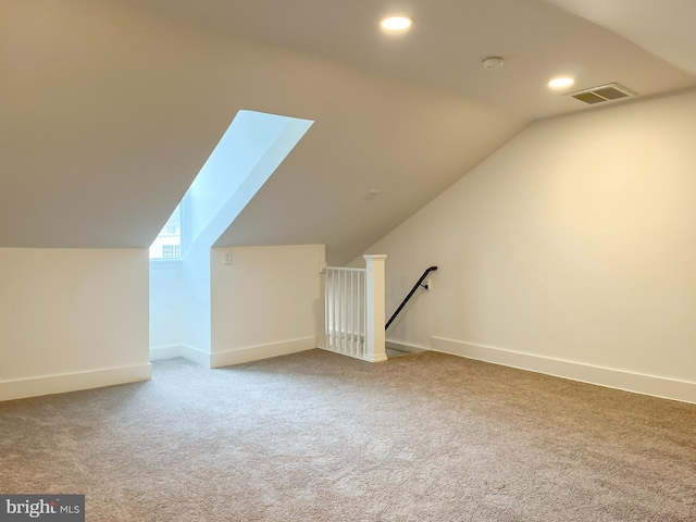 additional living space with carpet, visible vents, baseboards, and recessed lighting