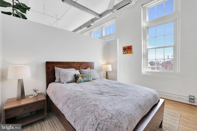 bedroom featuring wood finished floors