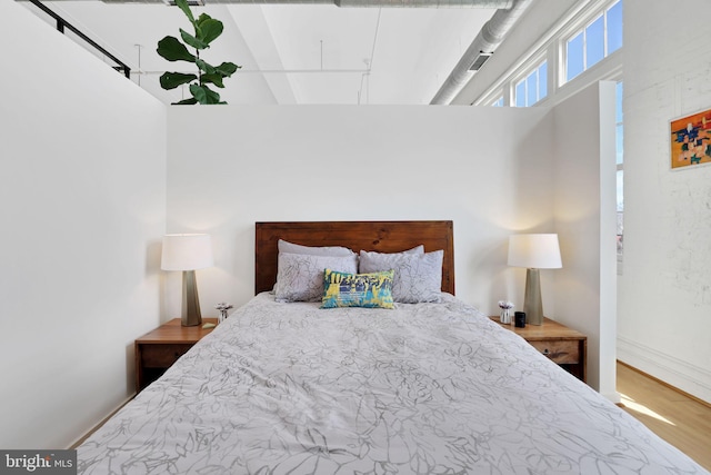 bedroom featuring wood finished floors