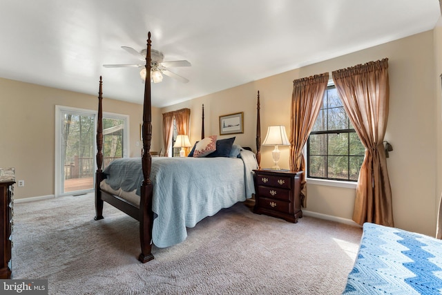 carpeted bedroom featuring access to outside, baseboards, and a ceiling fan