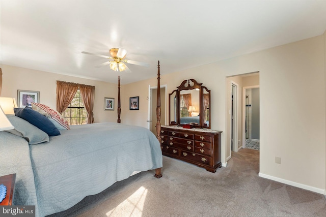 bedroom featuring light colored carpet, ceiling fan, and baseboards