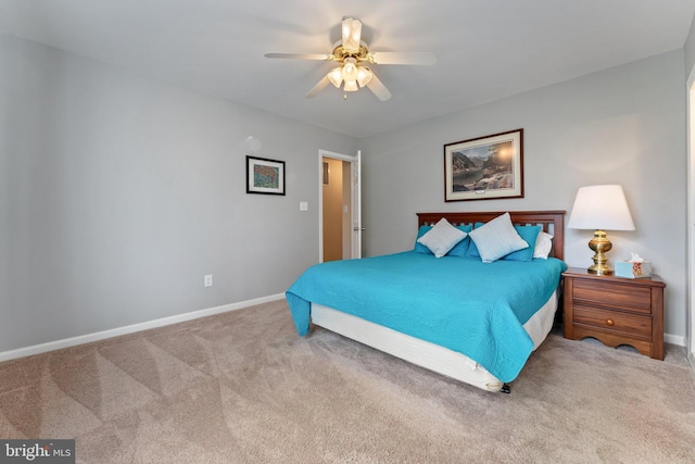 bedroom featuring carpet floors, baseboards, and a ceiling fan