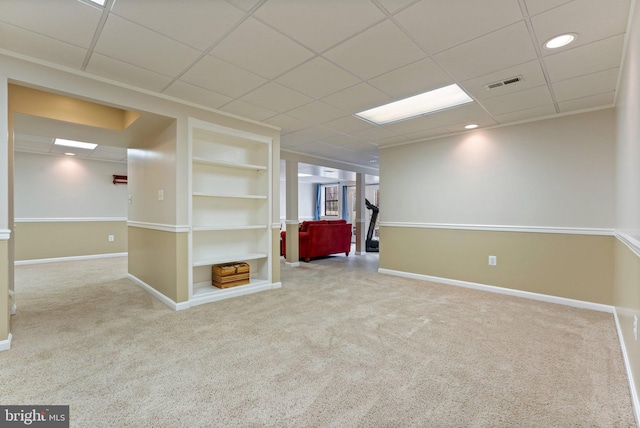 unfurnished room with built in shelves, recessed lighting, visible vents, carpet flooring, and baseboards