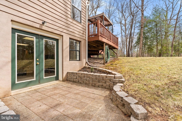 view of patio with a deck and french doors