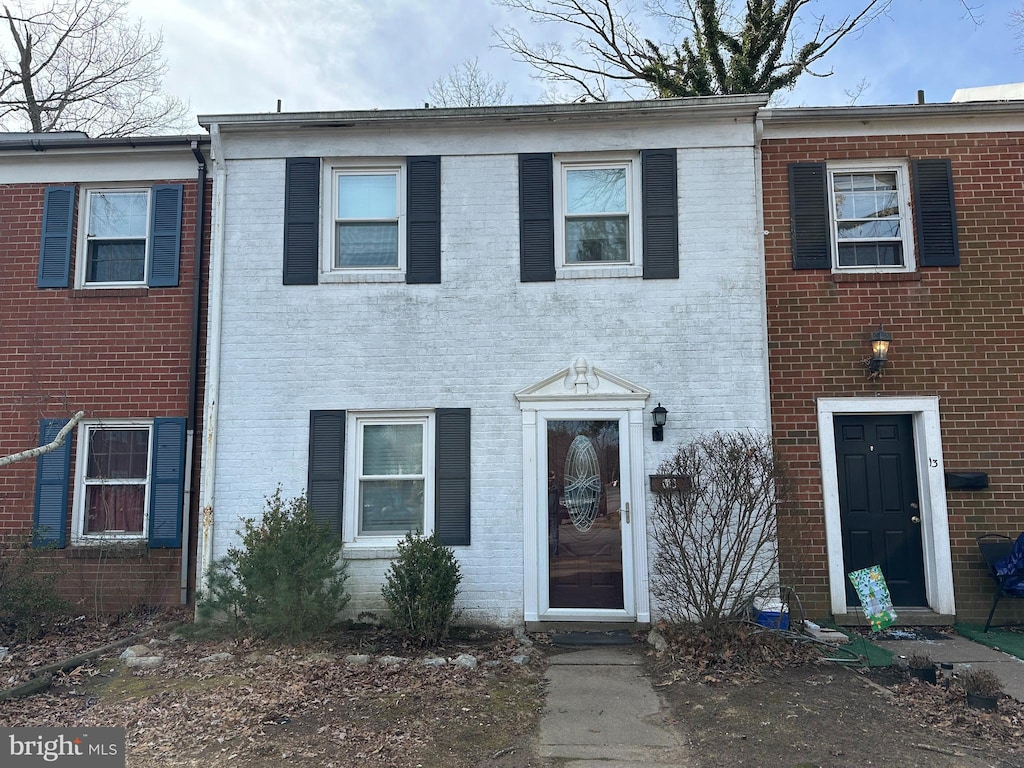 view of property with brick siding