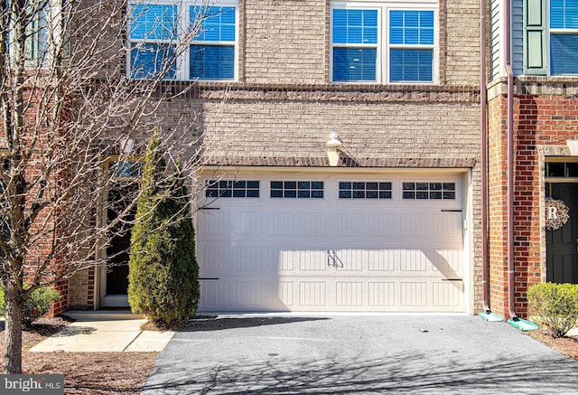 garage featuring driveway