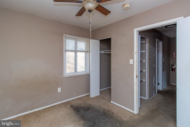 unfurnished bedroom with a closet and baseboards