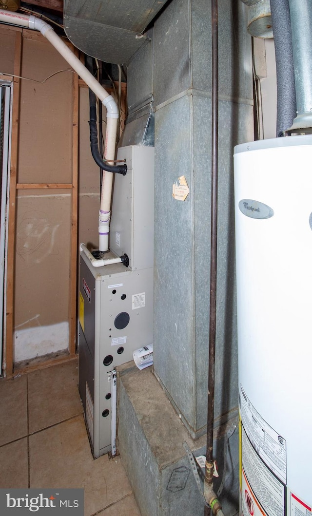 utility room featuring gas water heater