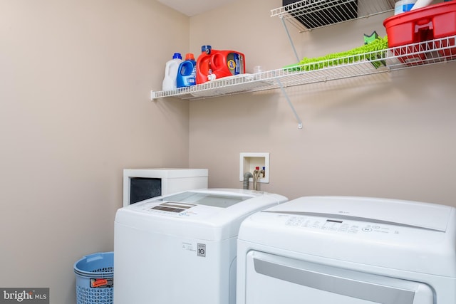 washroom with laundry area and washer and clothes dryer