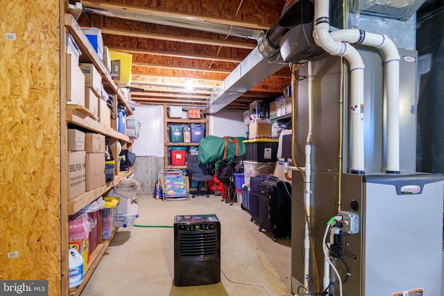 unfinished basement featuring heating unit