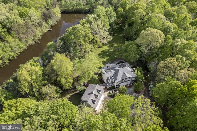 aerial view featuring a wooded view