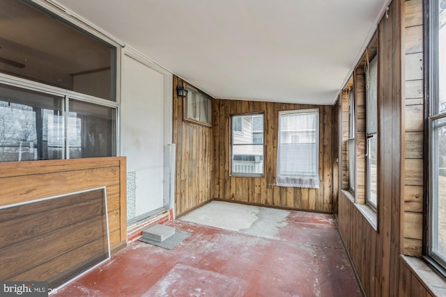 unfurnished sunroom with vaulted ceiling