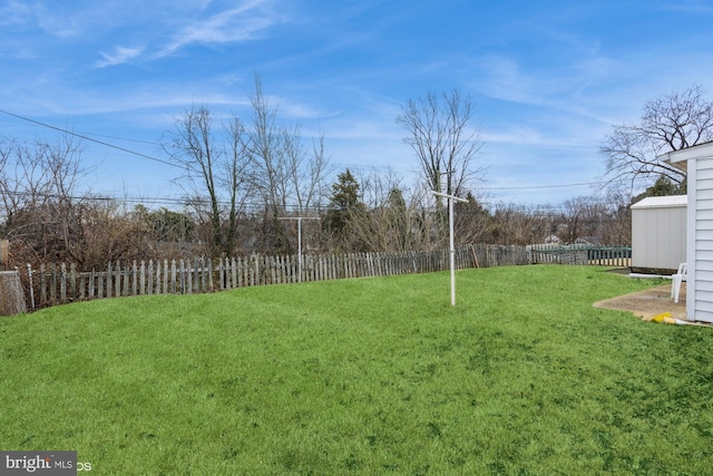 view of yard with a fenced backyard