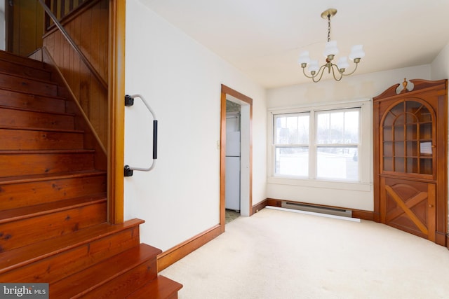 dining space with a chandelier, carpet floors, baseboards, stairway, and baseboard heating