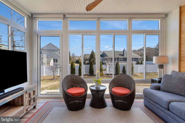 interior space featuring wood ceiling, a residential view, and wood finished floors