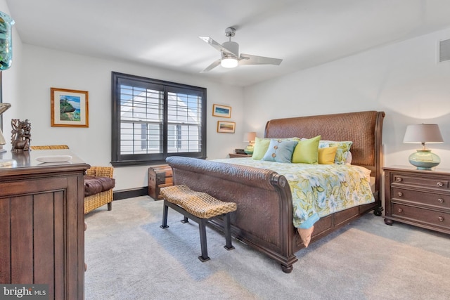 bedroom featuring visible vents, carpet, and a ceiling fan