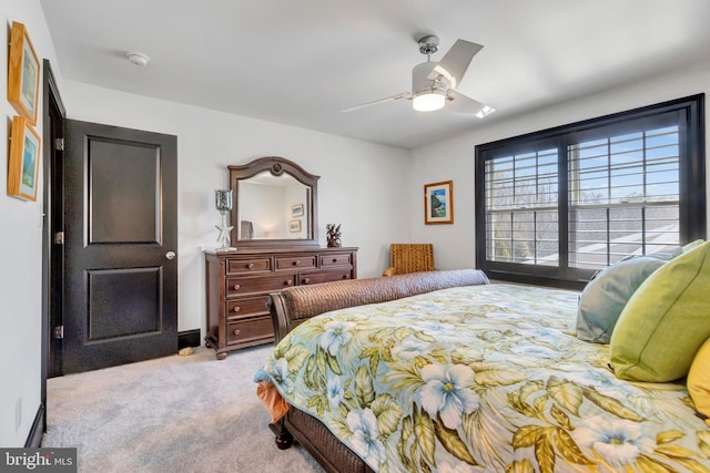 carpeted bedroom featuring ceiling fan