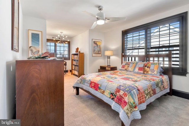 carpeted bedroom featuring baseboards and a notable chandelier