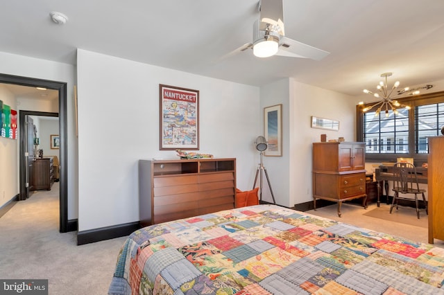 bedroom featuring light carpet, baseboards, and an inviting chandelier