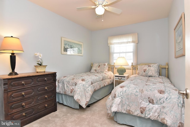 carpeted bedroom with a ceiling fan