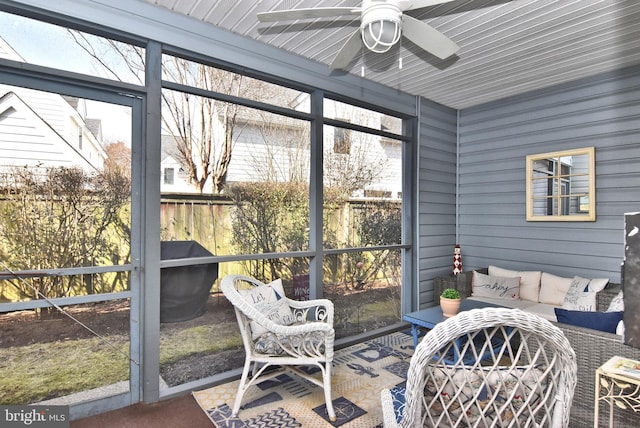 sunroom featuring plenty of natural light and ceiling fan