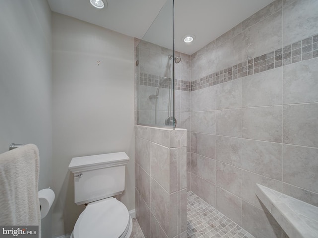 bathroom with a walk in shower, toilet, and recessed lighting