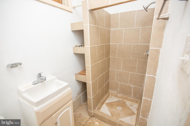 full bath featuring a stall shower and vanity