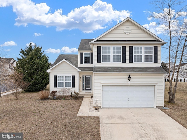 traditional-style house with a garage and concrete driveway