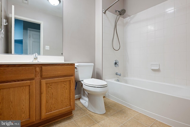 bathroom featuring toilet, shower / bathtub combination, vanity, and tile patterned floors