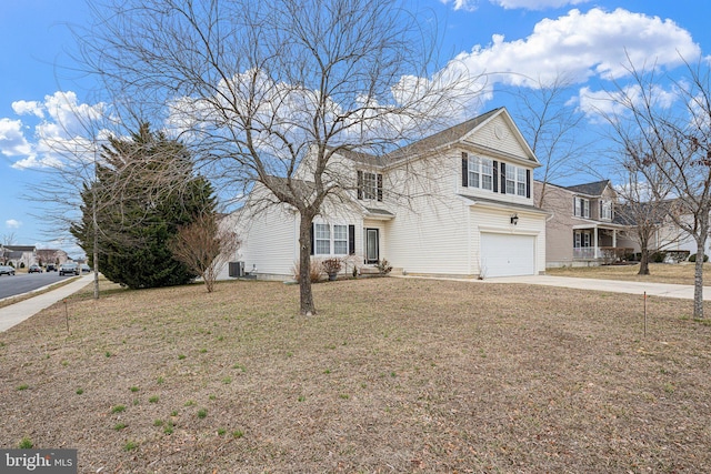 traditional home with driveway, an attached garage, cooling unit, and a front yard