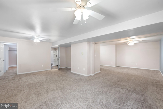 interior space featuring ceiling fan, carpet flooring, and baseboards