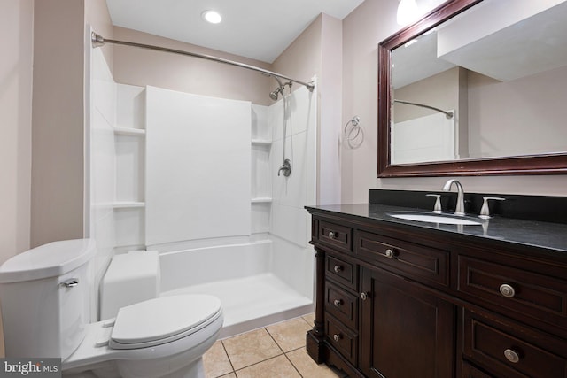 full bathroom with a shower, vanity, toilet, and tile patterned floors