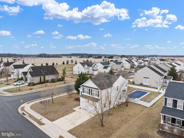 birds eye view of property with a residential view