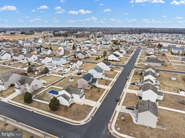 birds eye view of property with a residential view