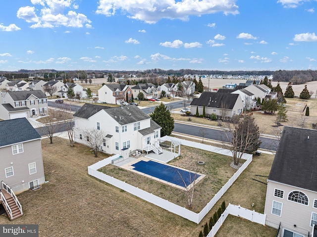 birds eye view of property with a residential view