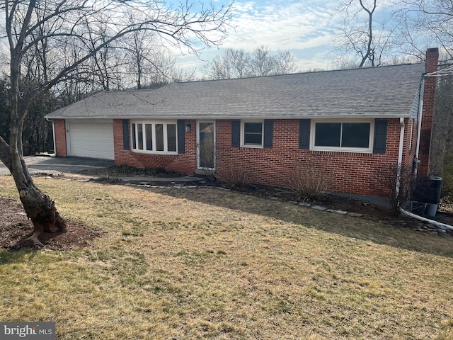 ranch-style home with brick siding, a front lawn, roof with shingles, a chimney, and an attached garage